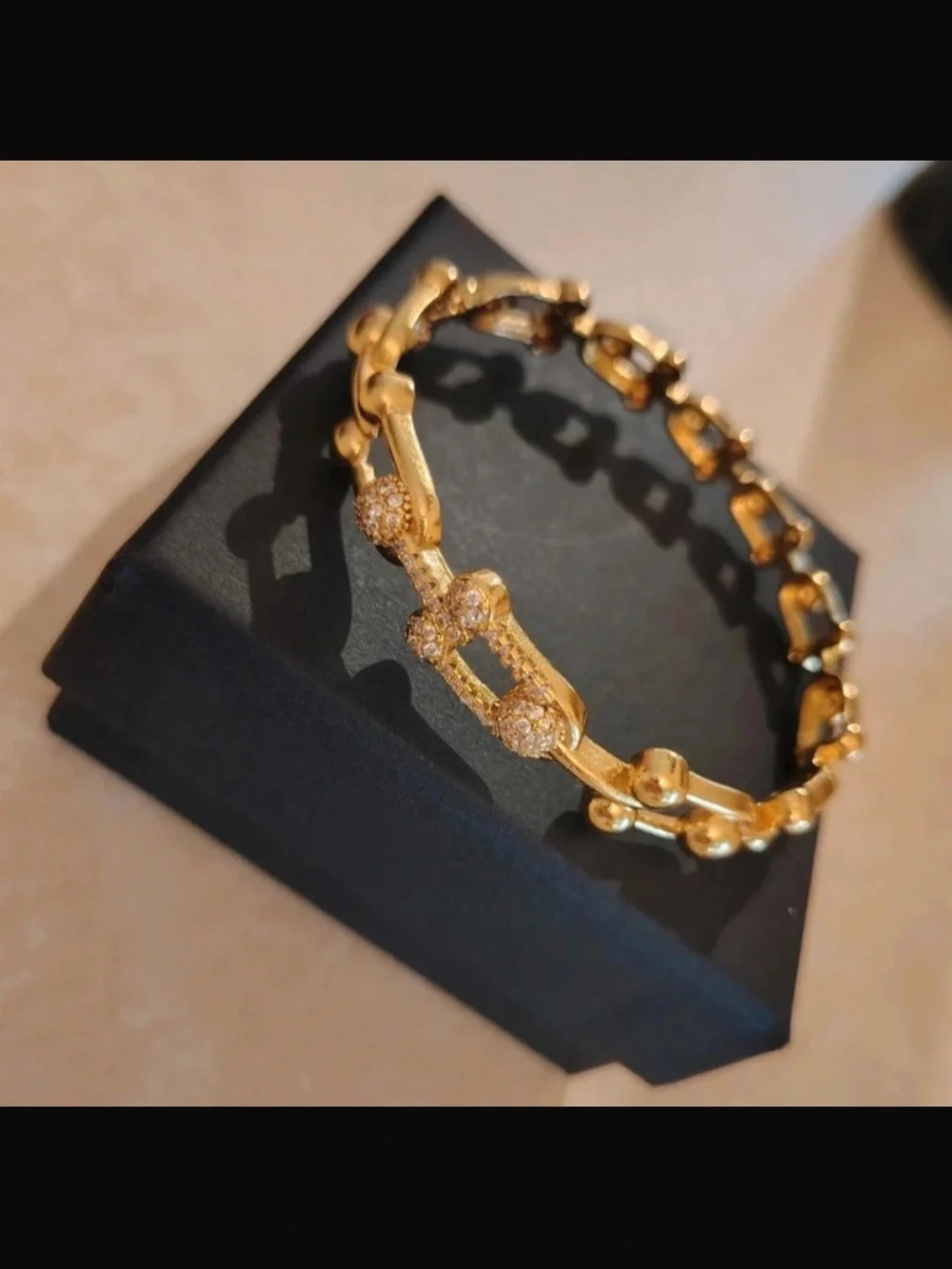 Goldtone bracelet.